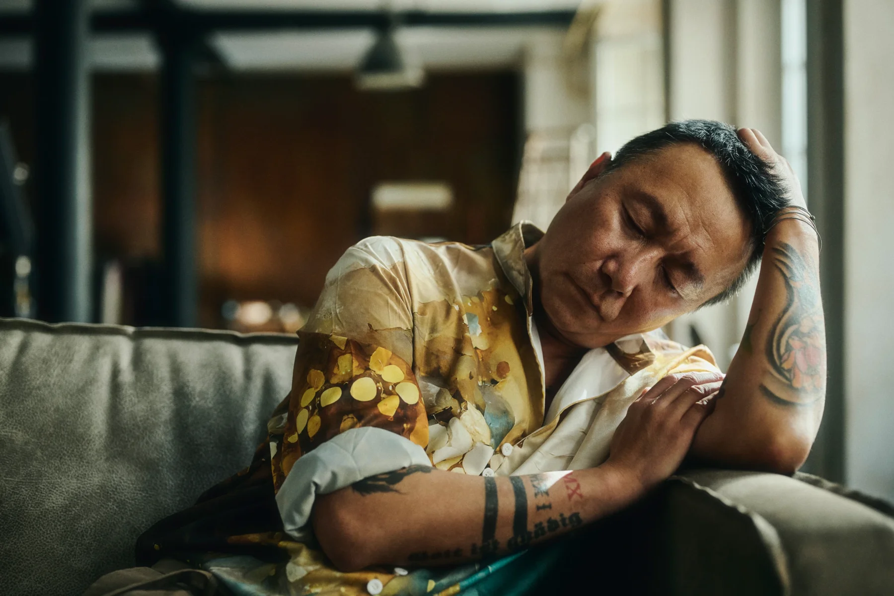 portrait of a man sitting on a sofa